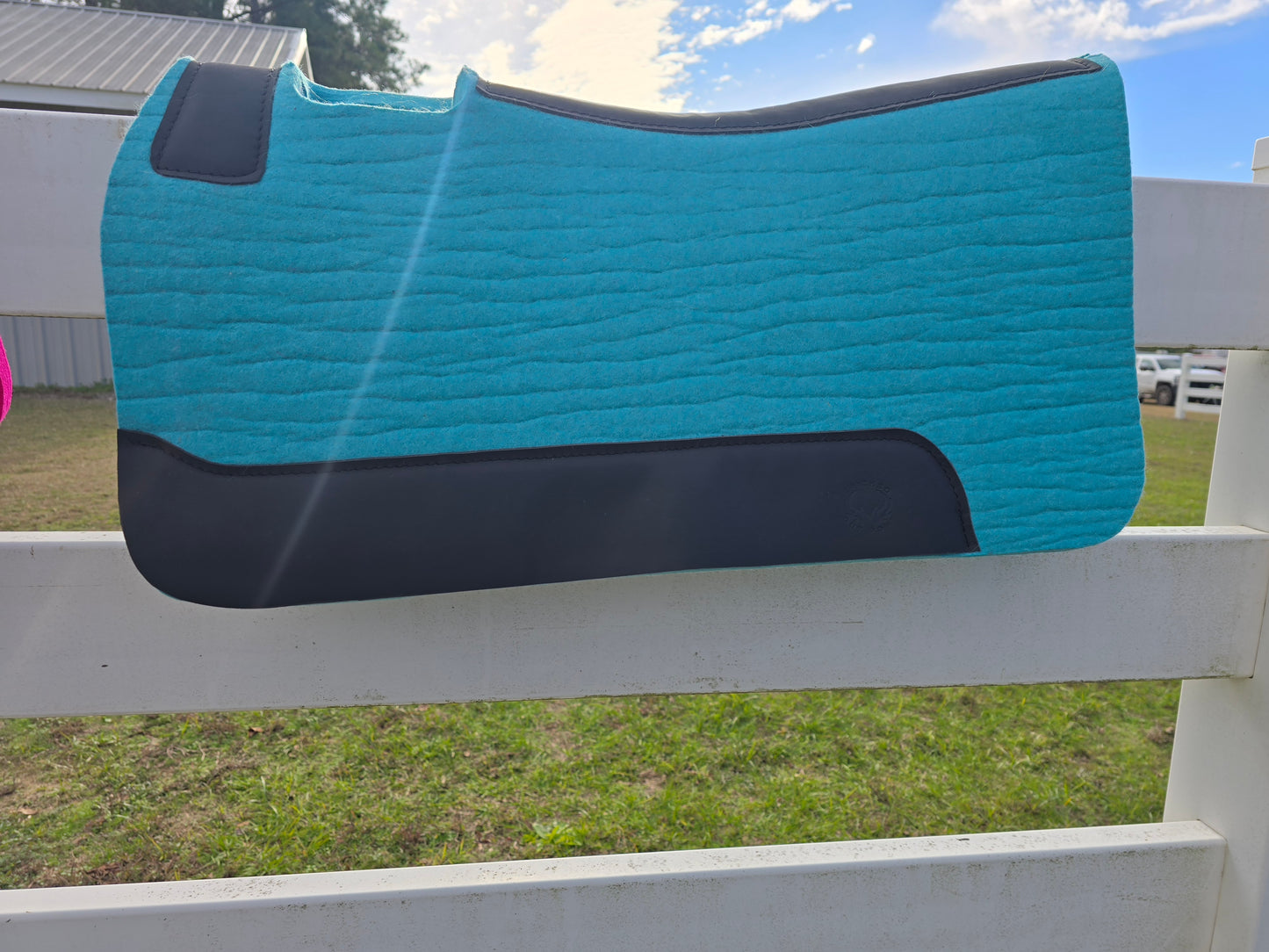 Teal pad with black leather